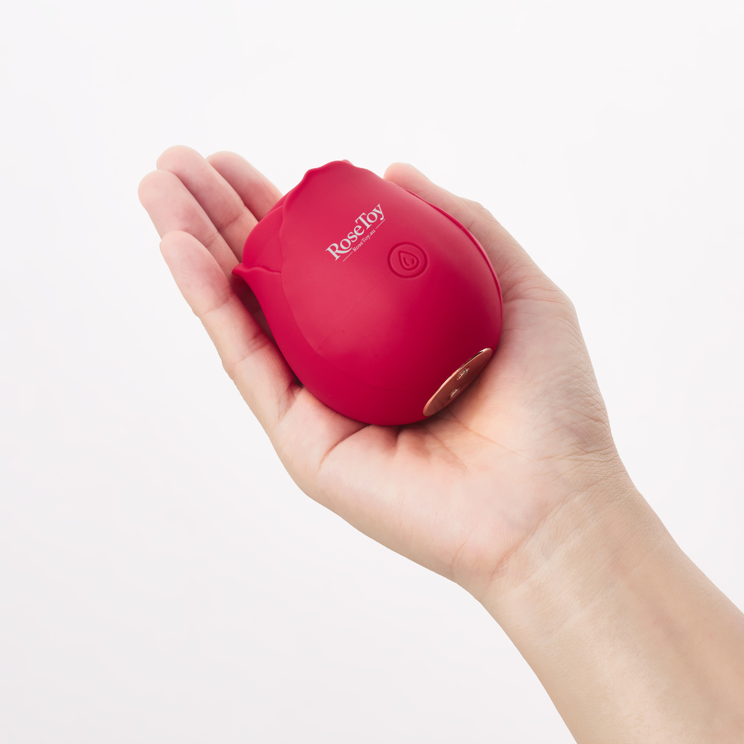The Rose vibrator held in hand showing its compact size