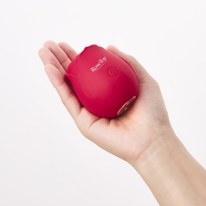 The Rose vibrator held in hand showing its compact size